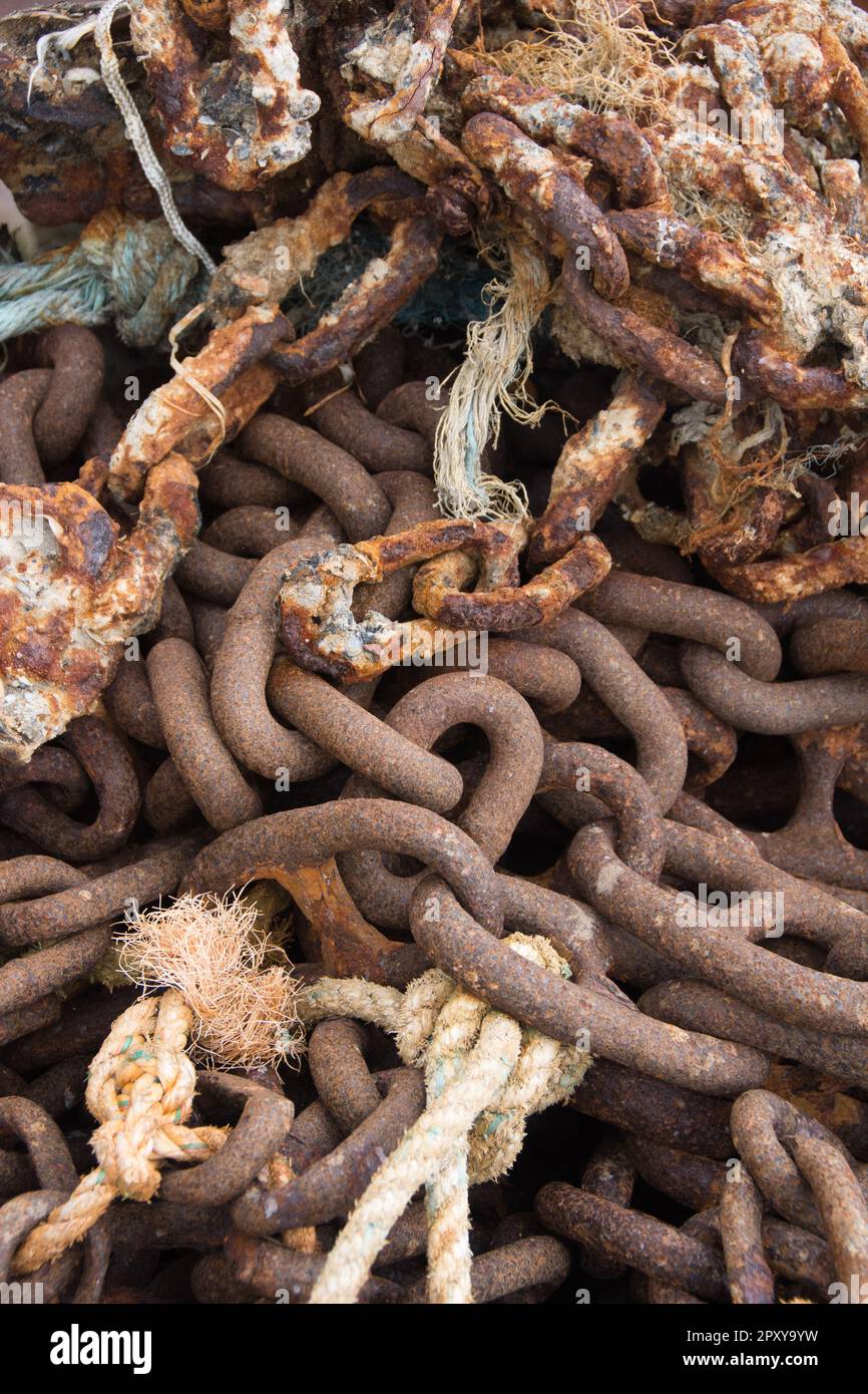 Rusty Marine Metal Chains with ropes Stock Photo