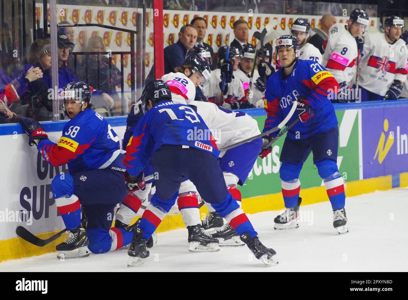 Nottingham, 29 April 2023. Heedoo Nam, Young Jun Lee and Jin Hui Ahn fight with Josh Waller for the puck during their match in the 2023 IIHF Ice Hockey World Championship, Division I, Group A tournament at the Motorpoint Arena, Nottingham. Credit: Colin Edwards Stock Photo