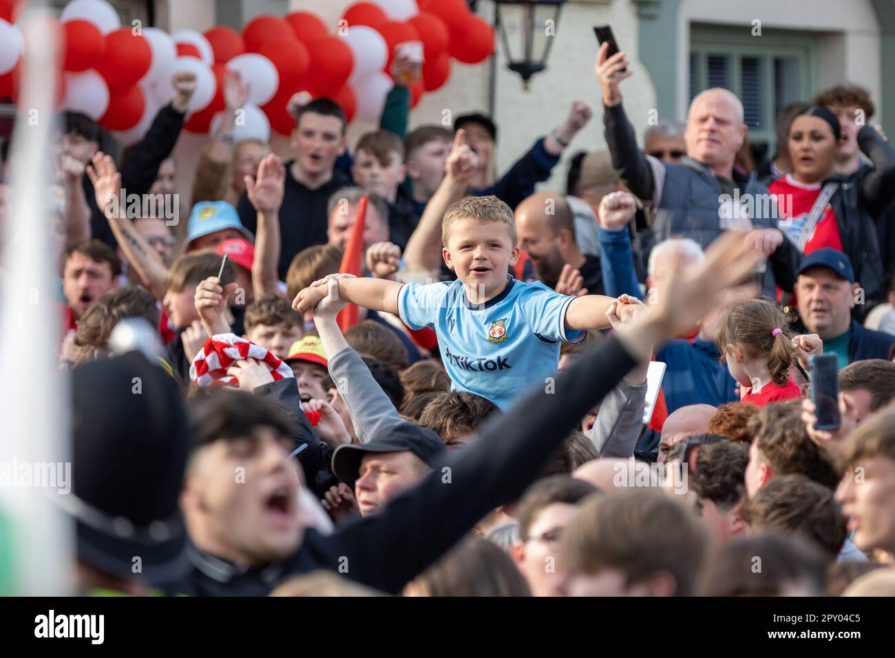 Wrexham, UK. 02nd May, 2023. A young Wrexham AFC fan chants during the