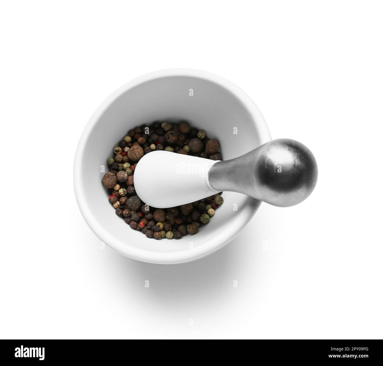 Mortar and pestle with peppercorns isolated on white background Stock
