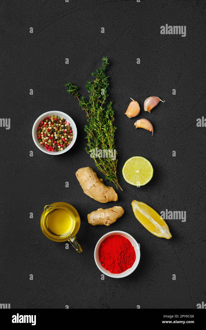Composition with condiments on black background. All purpose spice, Stock Photo