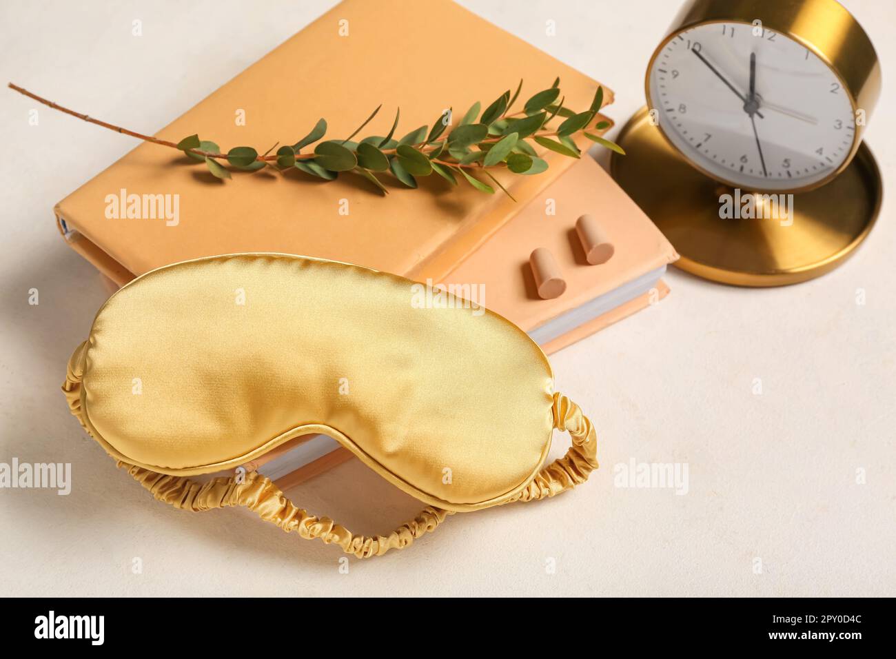 Sleep mask, earplugs and alarm clock on light background Stock Photo Alamy