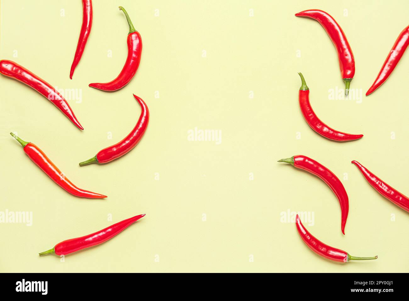 Fresh hot chili peppers on pale yellow background Stock Photo - Alamy