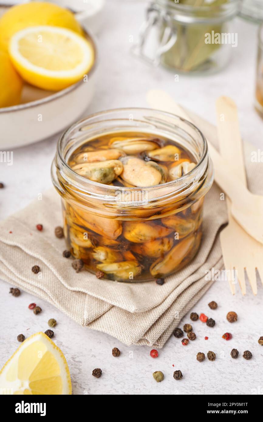 Jar with pickled mussels on white background Stock Photo Alamy