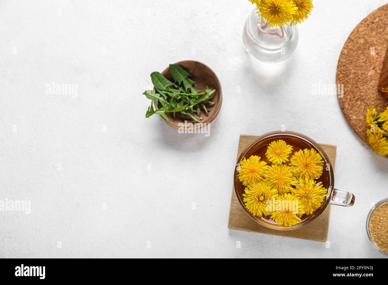 Glass cup of healthy dandelion tea on white background Stock Photo - Alamy