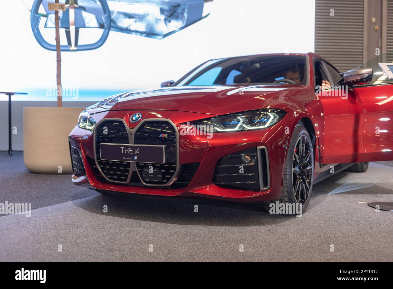 Gothenburg, Sweden - december 05 2021: Red 2022 BMW i4 M50 on display. Stock Photo