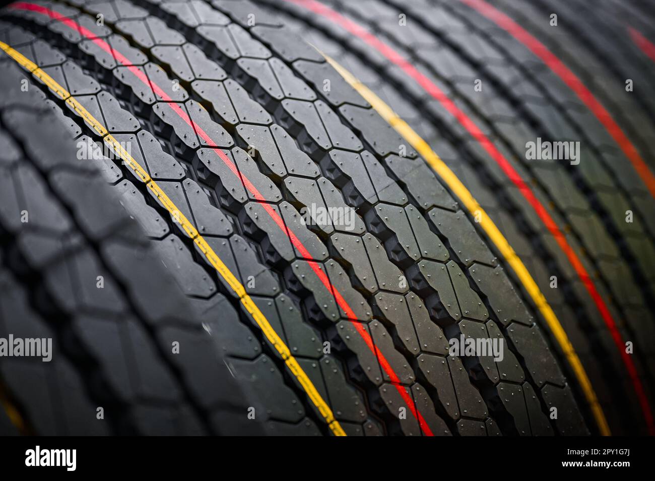Stack of tires with markings red and yellow lines Stock Photo Alamy