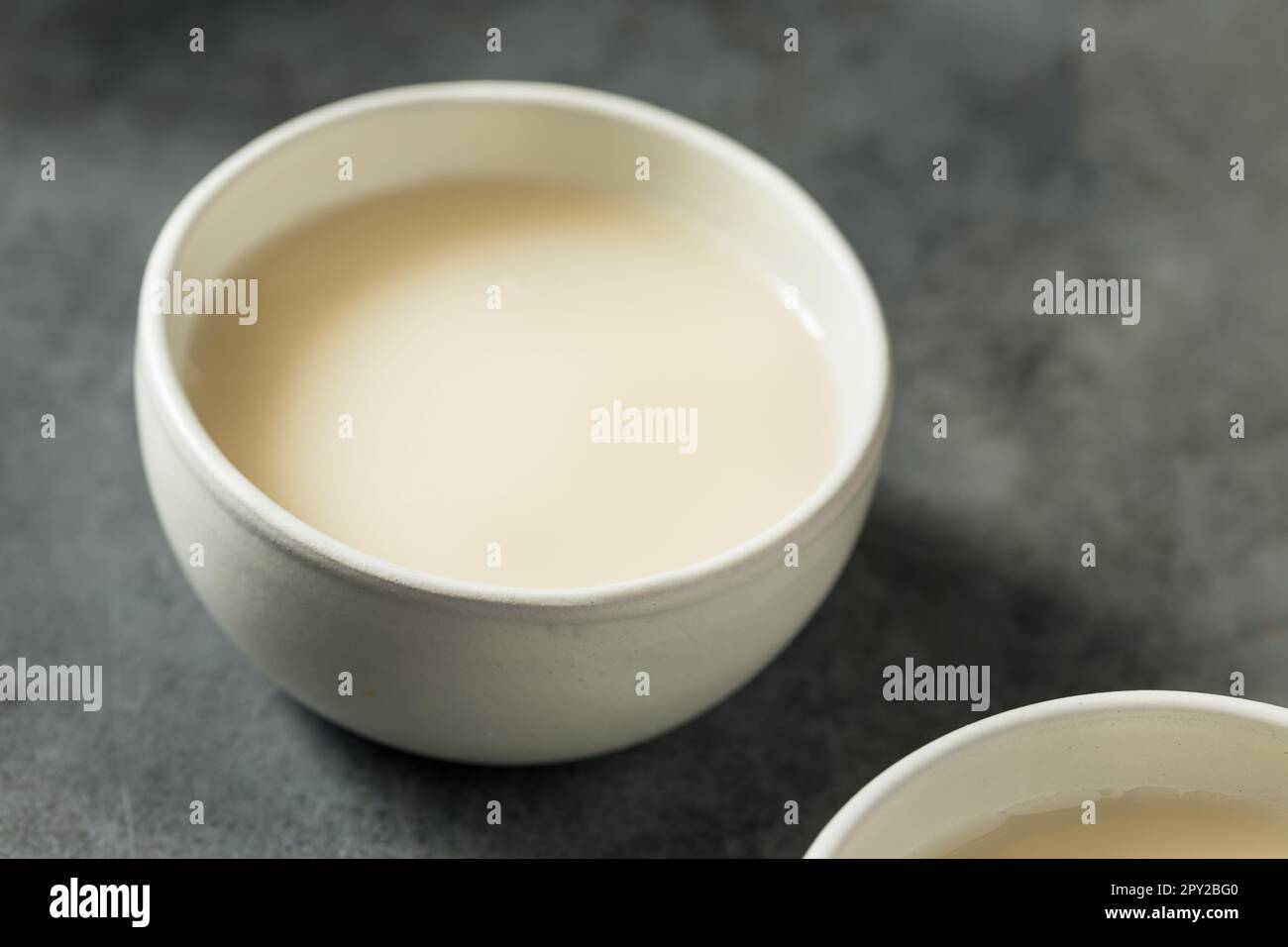 Boozy Makgeolli Korean Rice Wine in a Bowl Stock Photo