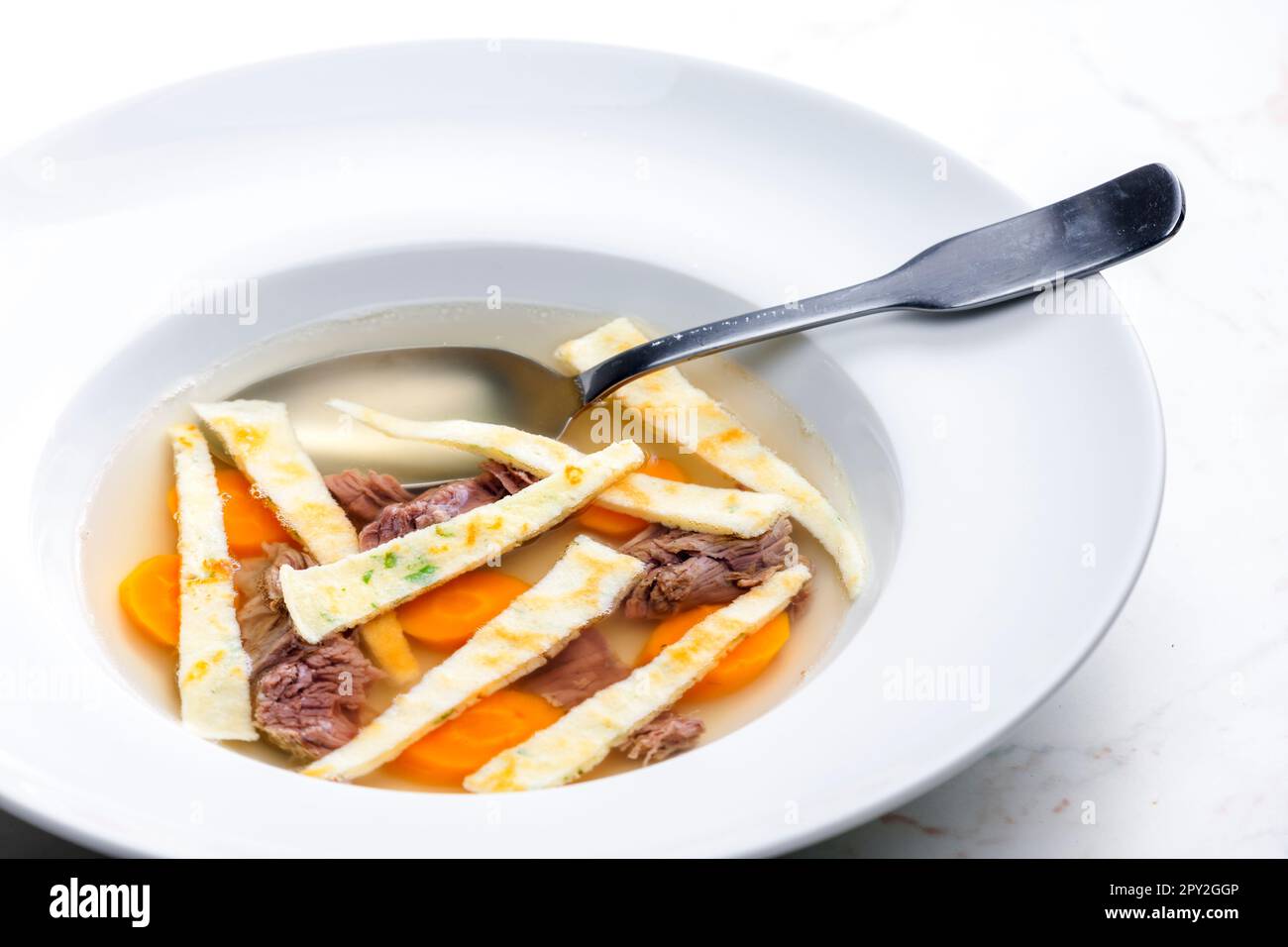 beef soup with celestine noodles and carrot Stock Photo