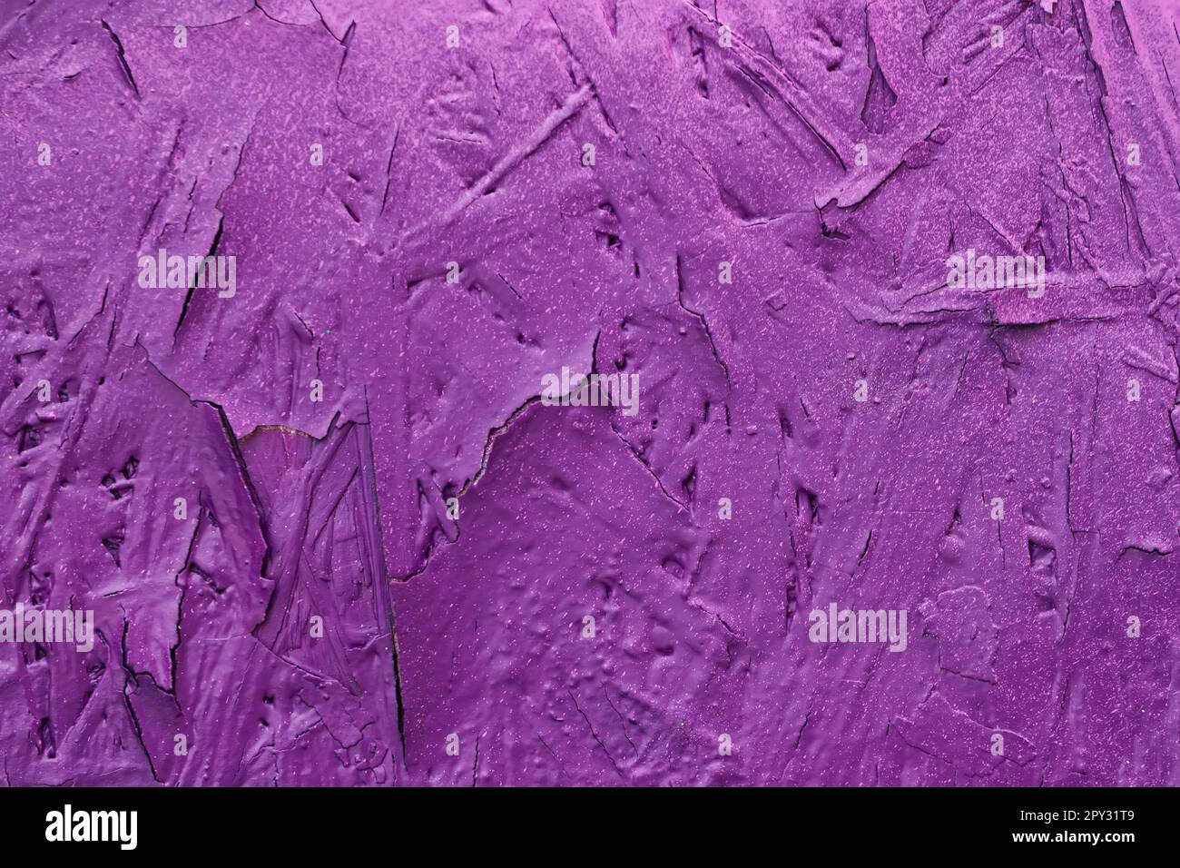 Concrete wall, Old flaky paint on surface, purple color, texture