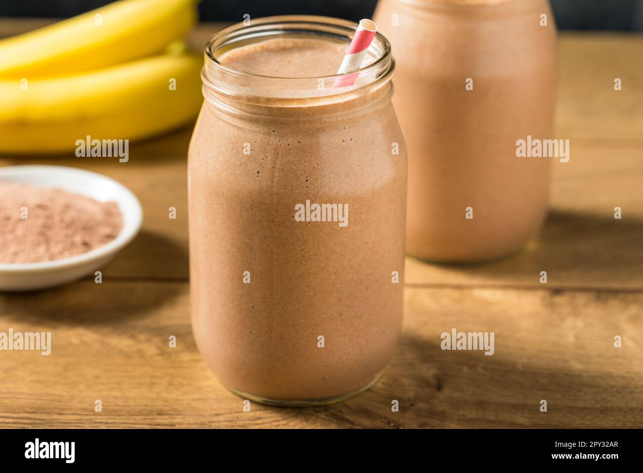 Sweet Frozen Chocolate Whey Protein Shake with Banana and Milk Stock