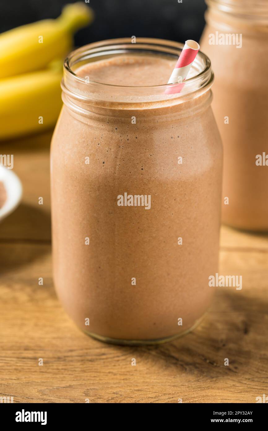 Sweet Frozen Chocolate Whey Protein Shake with Banana and Milk Stock