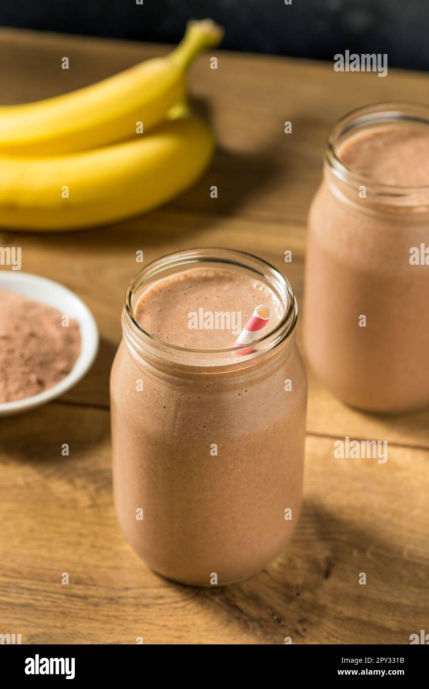 Sweet Frozen Chocolate Whey Protein Shake with Banana and Milk Stock
