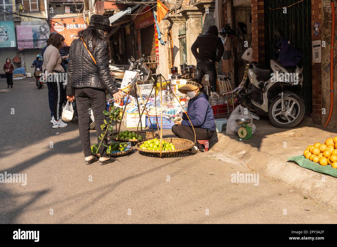 Hanoi, Vietnam, January 2023.  panoramic view of  the traditional food vendors on the  street in the city center. Stock Photo