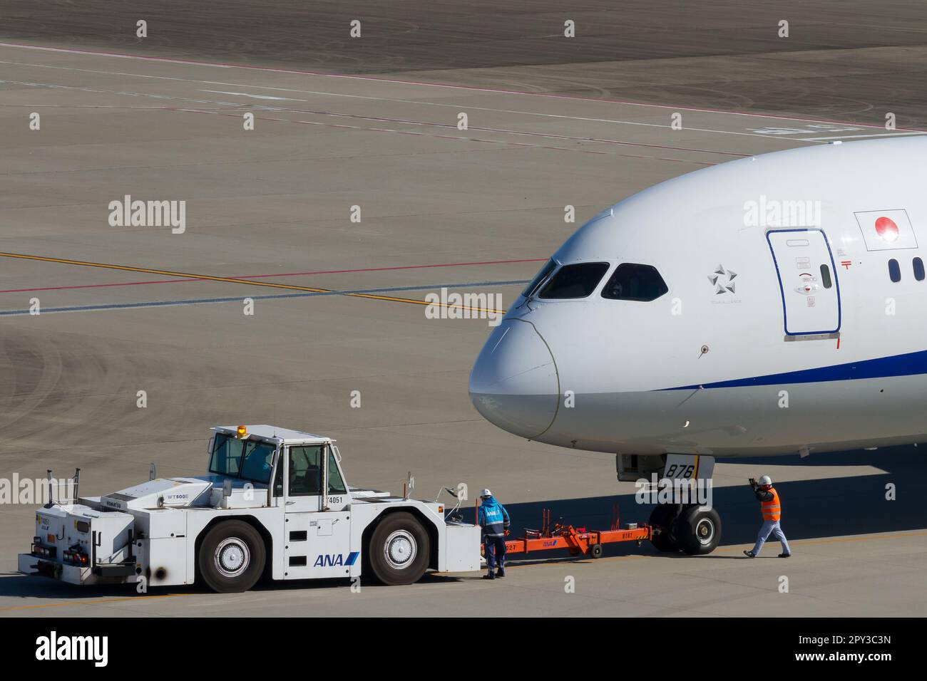 An All Nippon Airways Ana Boeing 787 9 Dreamliner Being Towed By A Pushback Tug On The An All Nippon Airways Ana Boeing 787 9 Dreamliner Being Towed By A Pushback Tug On The