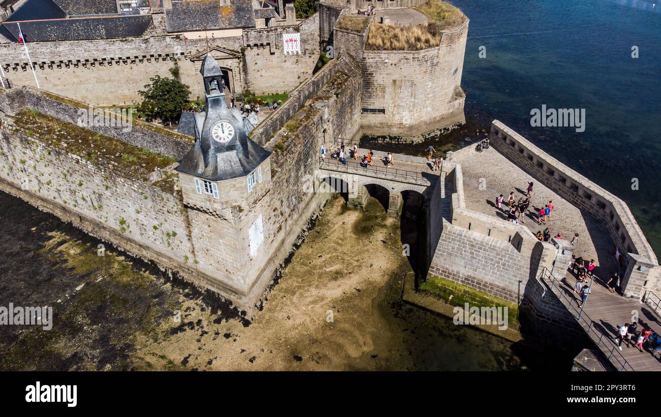 Aerial view of Concarneau, a medieval walled city in Brittany, France - Stone bridge leading to the main entrance gate near the clock tower Stock Photo