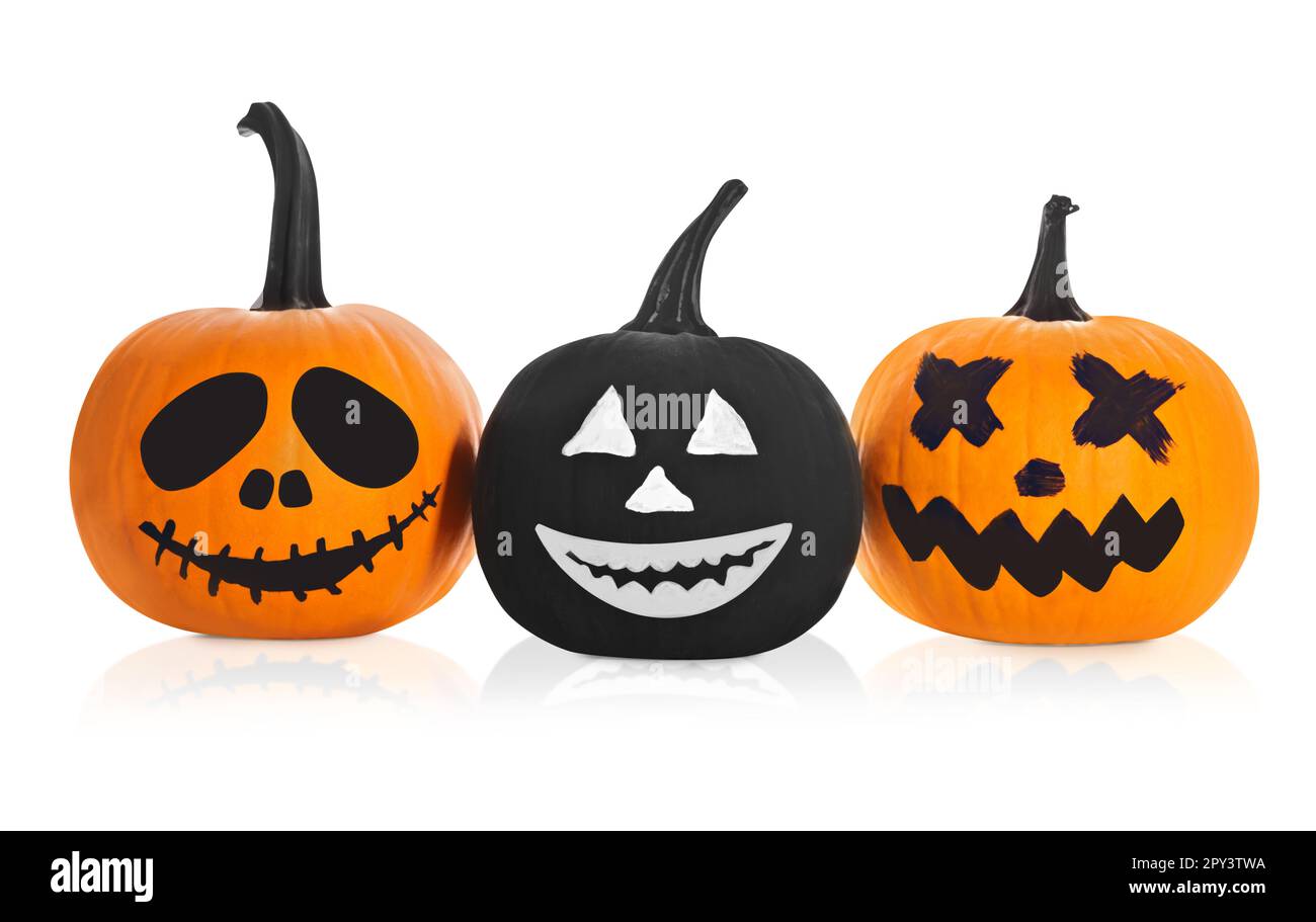 Halloween pumpkins with scary drawn faces on white background Stock ...