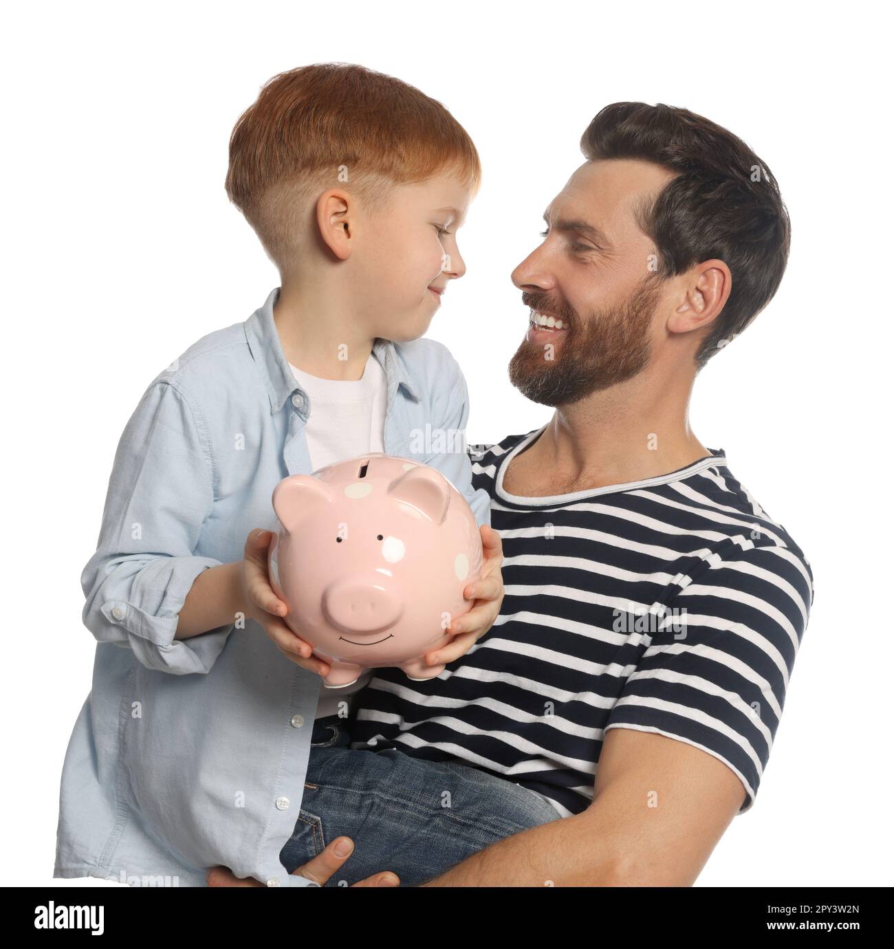 Father and his son with ceramic piggy bank on white background Stock ...