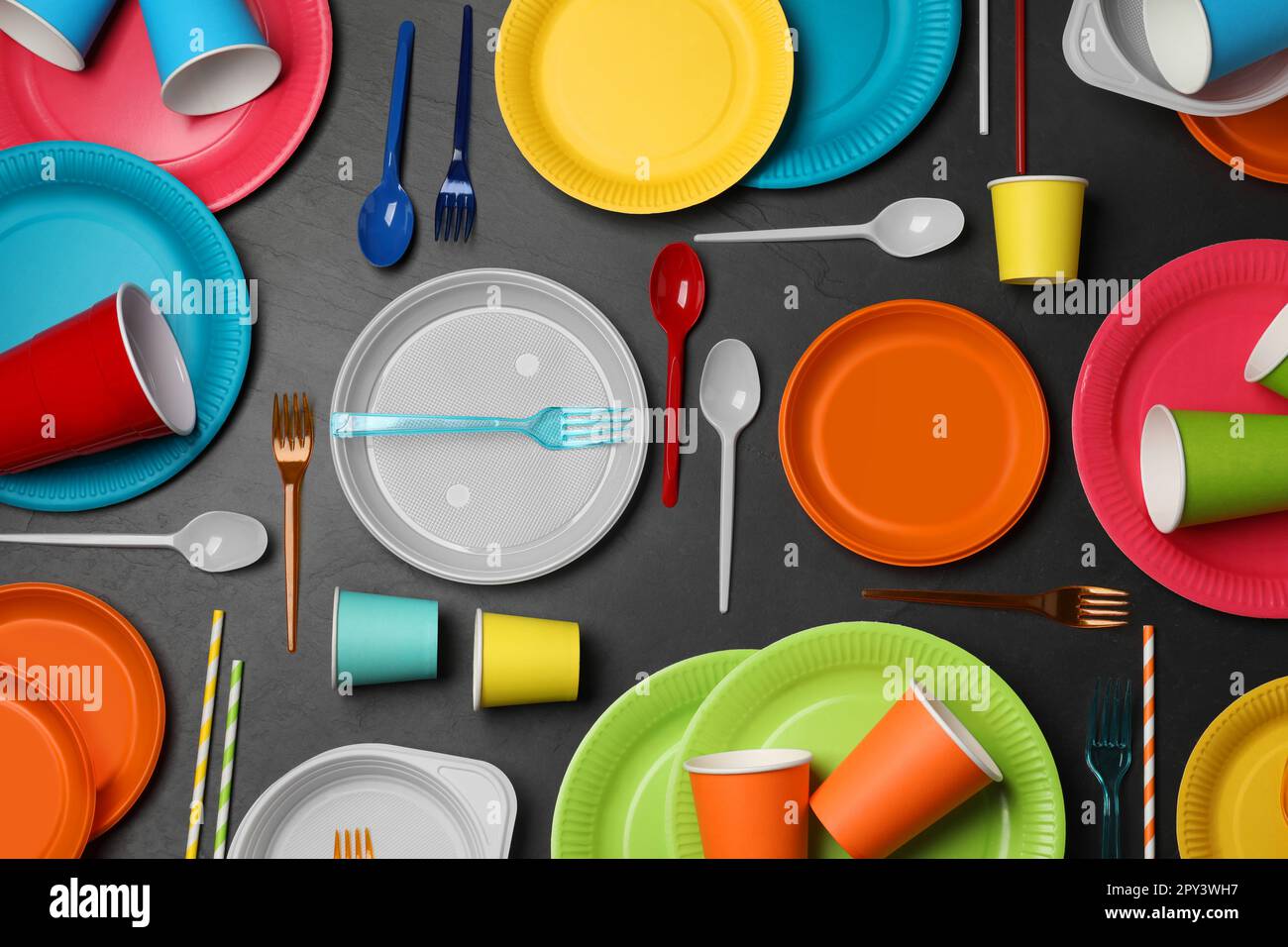 Flat lay composition with different disposable tableware on black ...