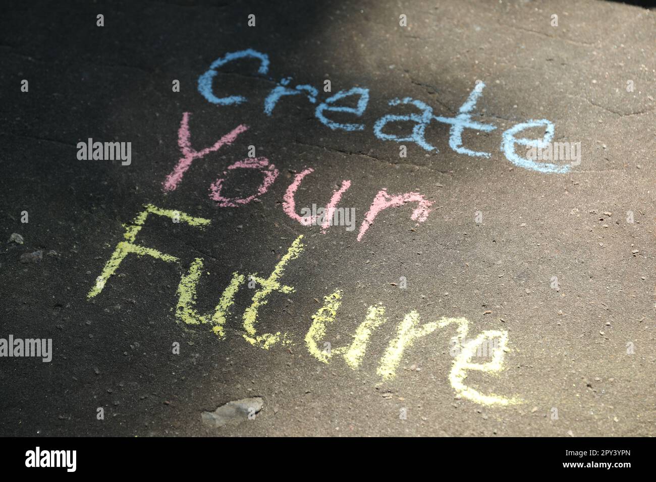 Phrase Create Your Future written on asphalt Stock Photo