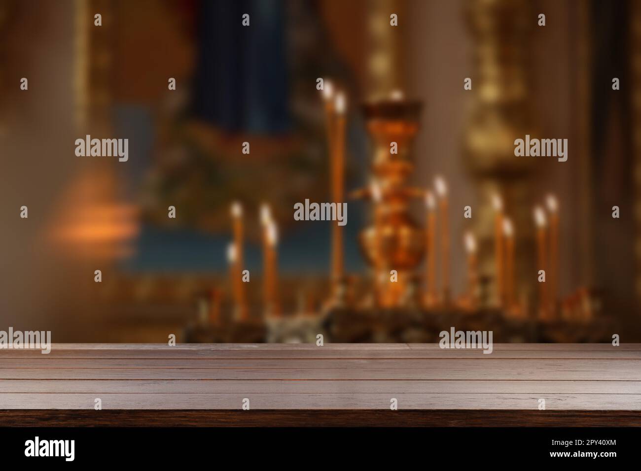 Empty wooden table and blurred view of beautiful church interior, space ...