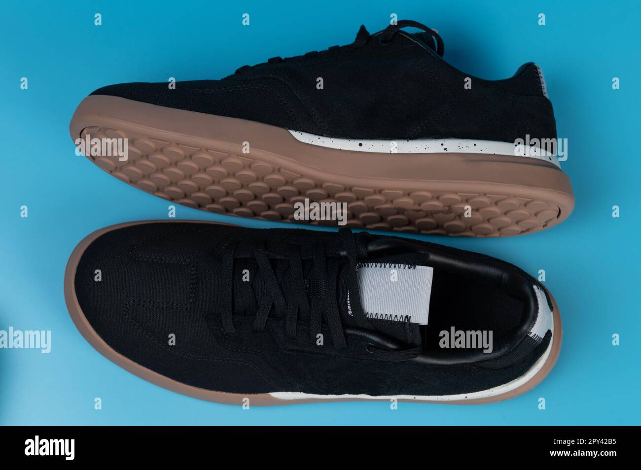 Comfortable black casual sneakers above top view isolated Stock Photo