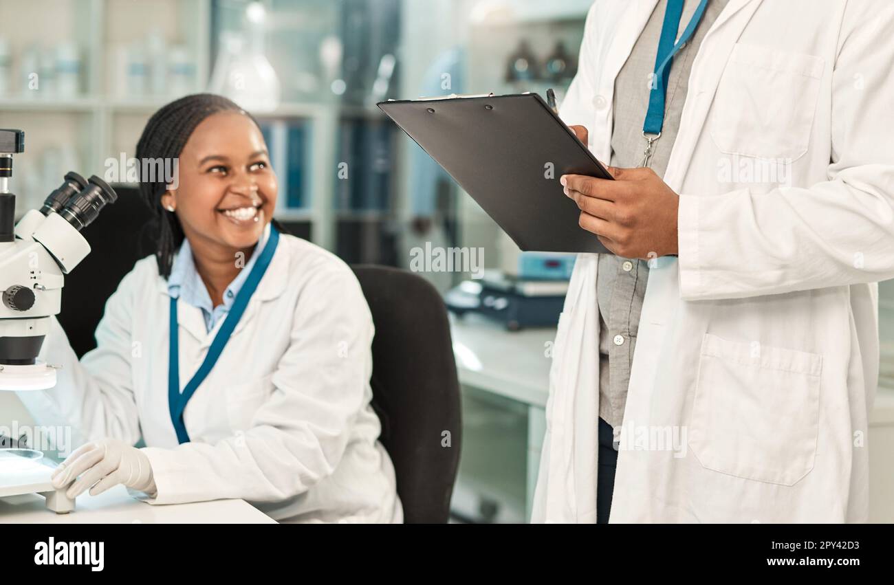 Getting all their lab work done. two scientists working together in a