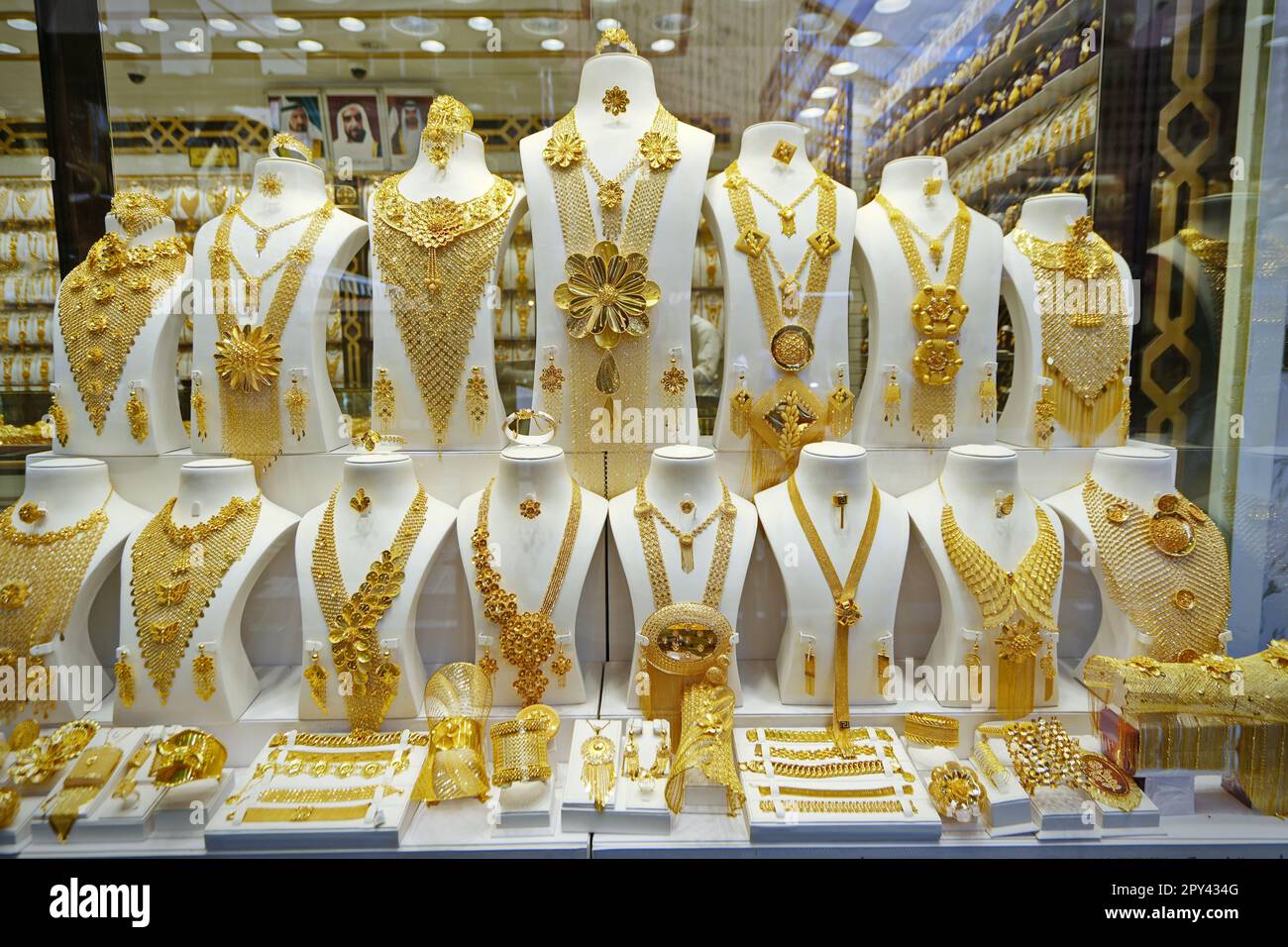 Dubai gold souk market window with jewellery, necklaces, dress and luxury accessories. DUBAI, UNITED ARAB EMIRATES - April, 2023 Stock Photo