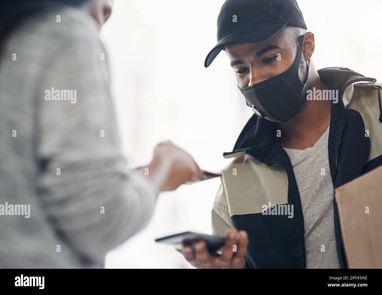 The safe way is the smart way. a masked young man and woman using ...