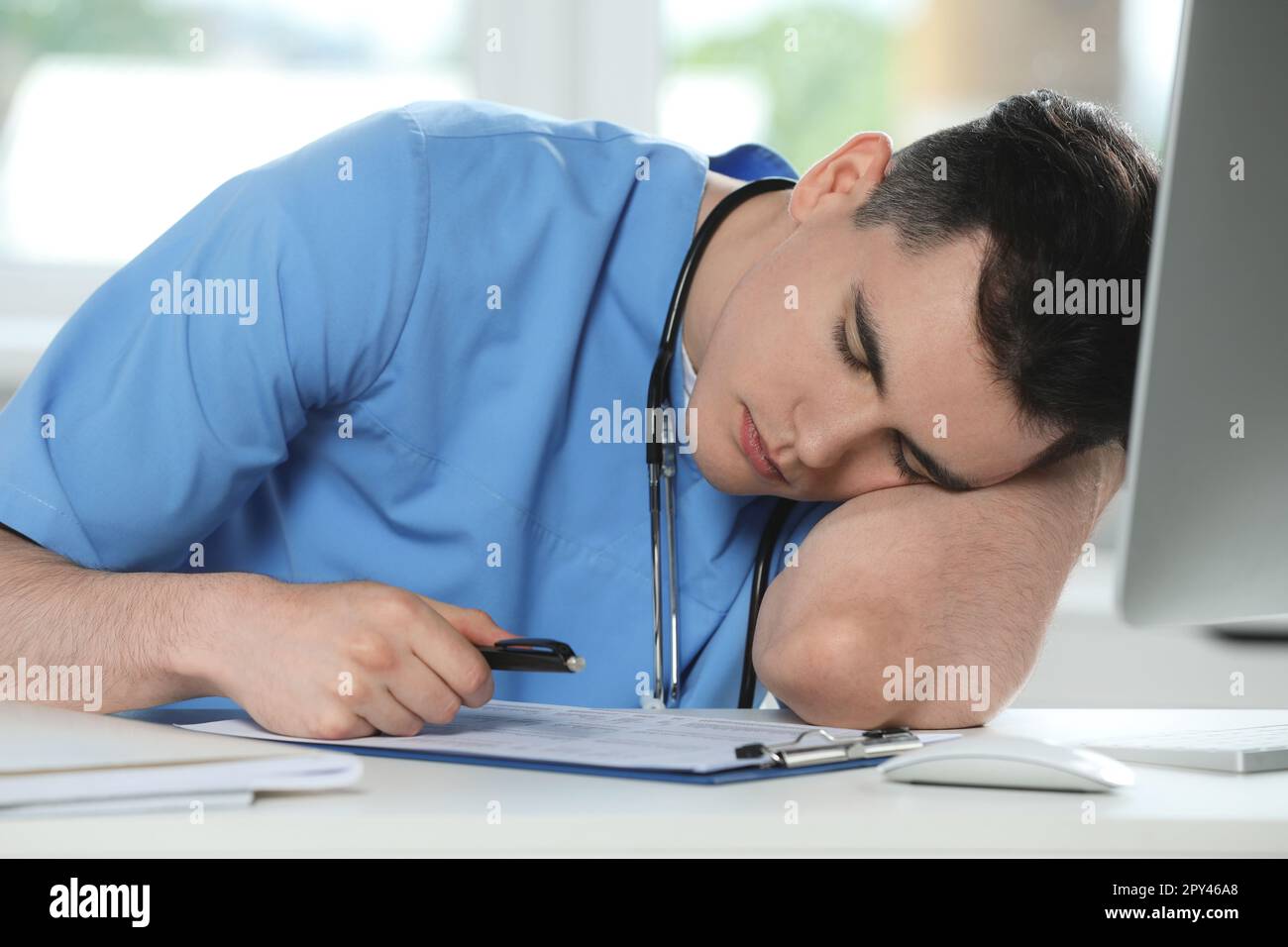 Exhausted doctor sleeping workplace hi-res stock photography and images ...