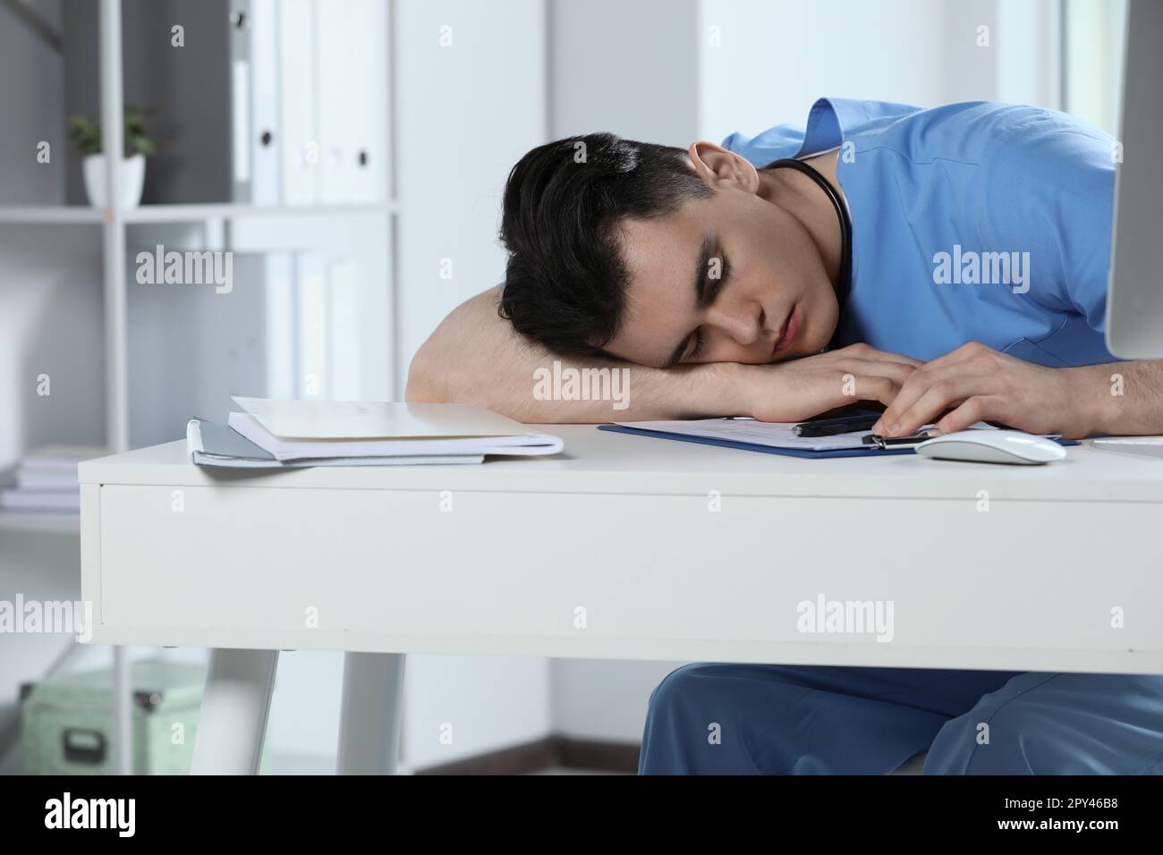 Exhausted doctor sleeping workplace hi-res stock photography and images ...