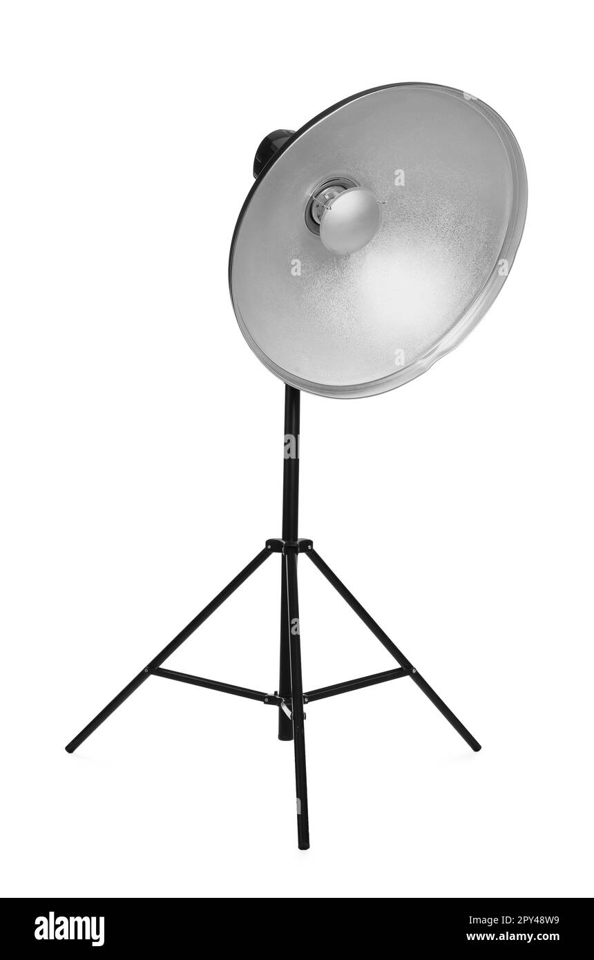 Studio flash light with reflector on tripod against white background