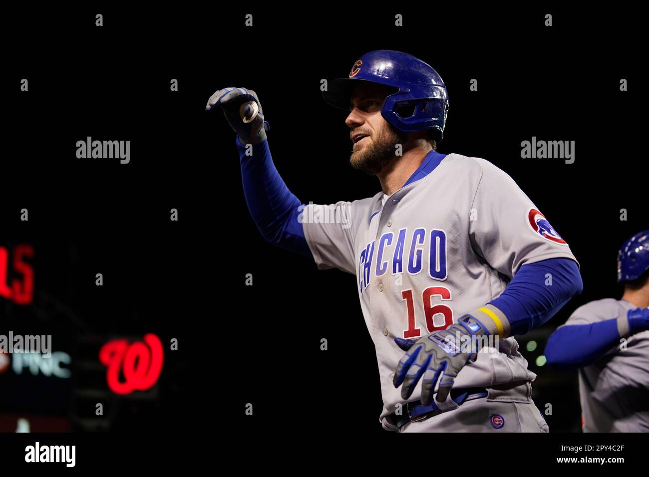 Chicago Cubs' Patrick Wisdom (16) celebrates after hitting a home run  during the seventh inning of