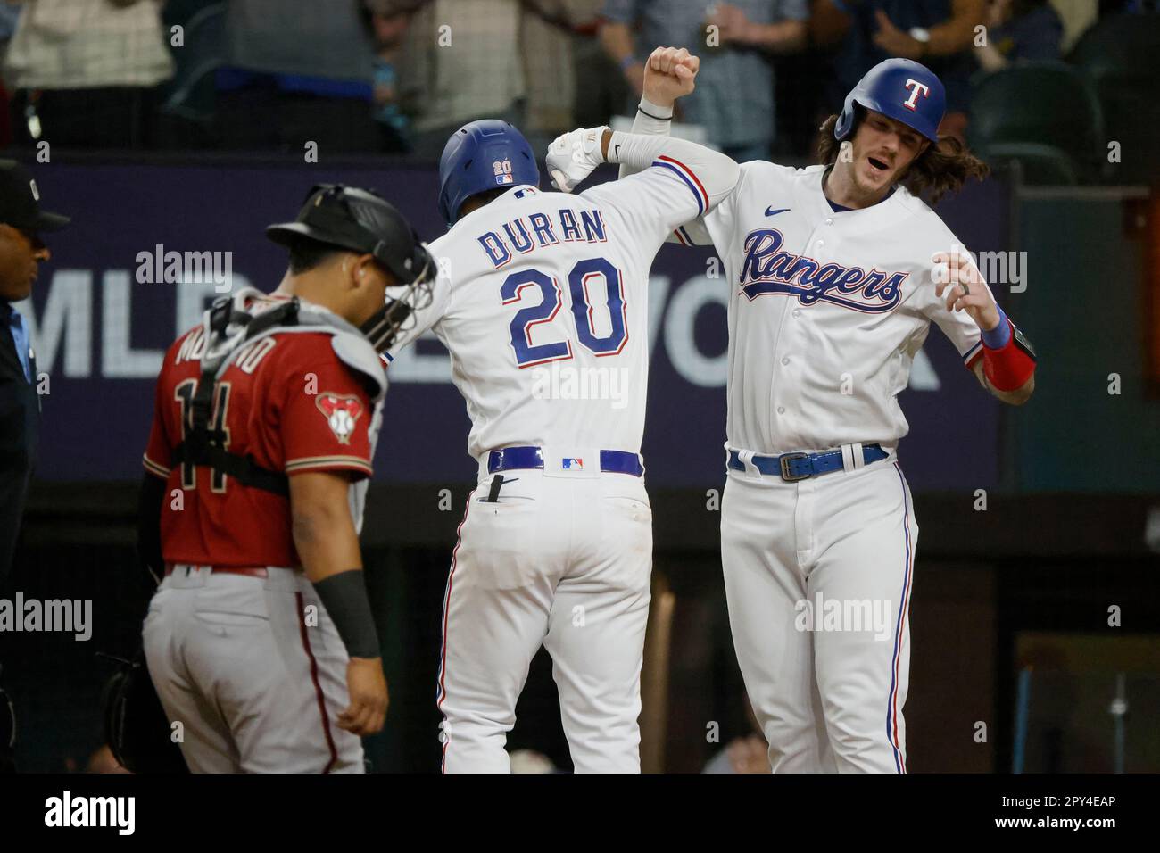 Texas Rangers' Ezequiel Duran, left, is caught stealing second