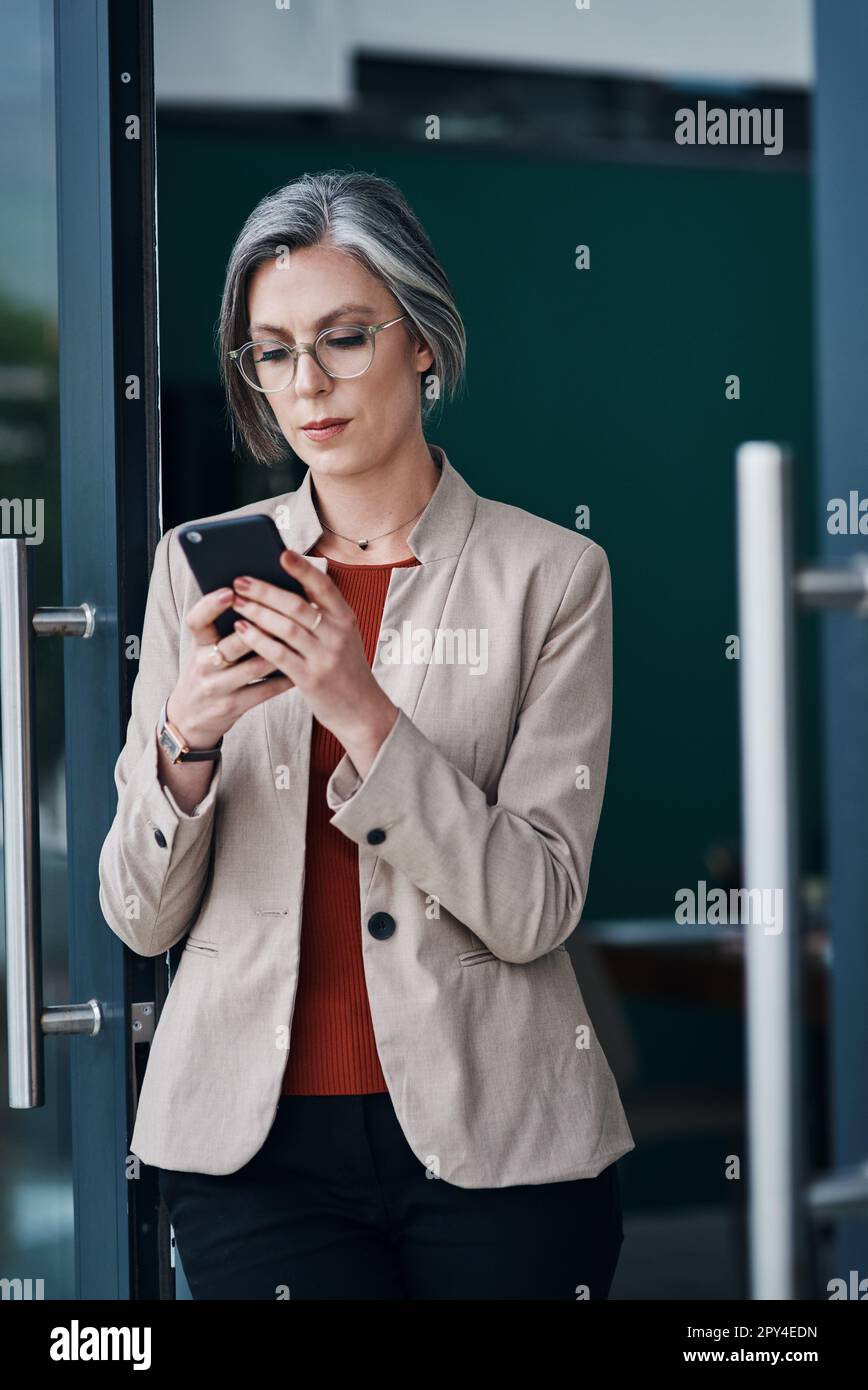 to the digital age. an attractive mature businesswoman standing