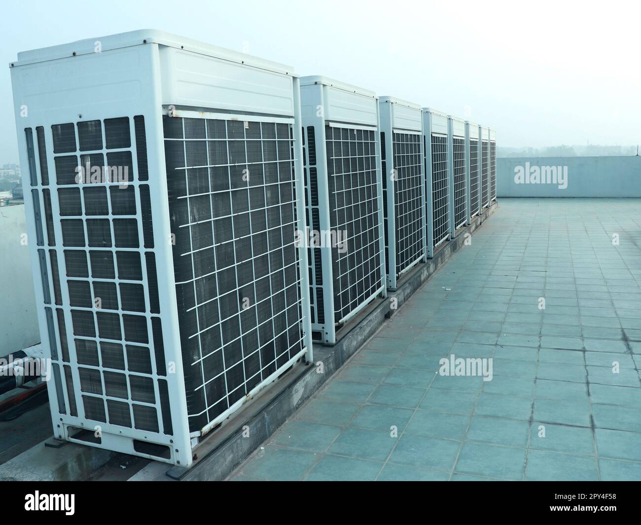 Industrial air conditioner condensers (outside unit) at the rooftop of the Office building Stock