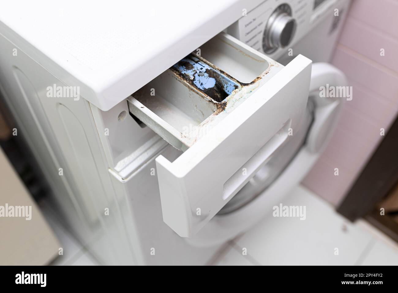 Laundry machine dispenser compartment for soap and powder detergent and