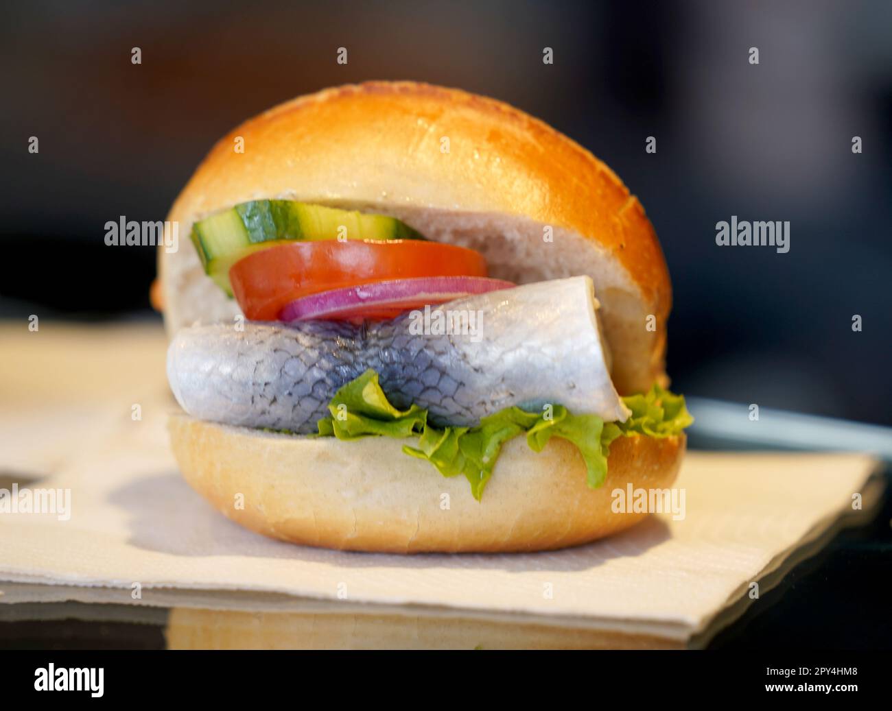 Hamburg, Germany. 25th Apr, 2023. A fish roll with a Bismarck herring lies on the counter of a snack bar at Landungsbrücken. World Fish Roll Day will be celebrated on May 6, 2023. (to dpa: "The north celebrates the "Day of the fish roll" - also new creations ") Credit: Marcus Brandt/dpa/Alamy Live News Stock Photo