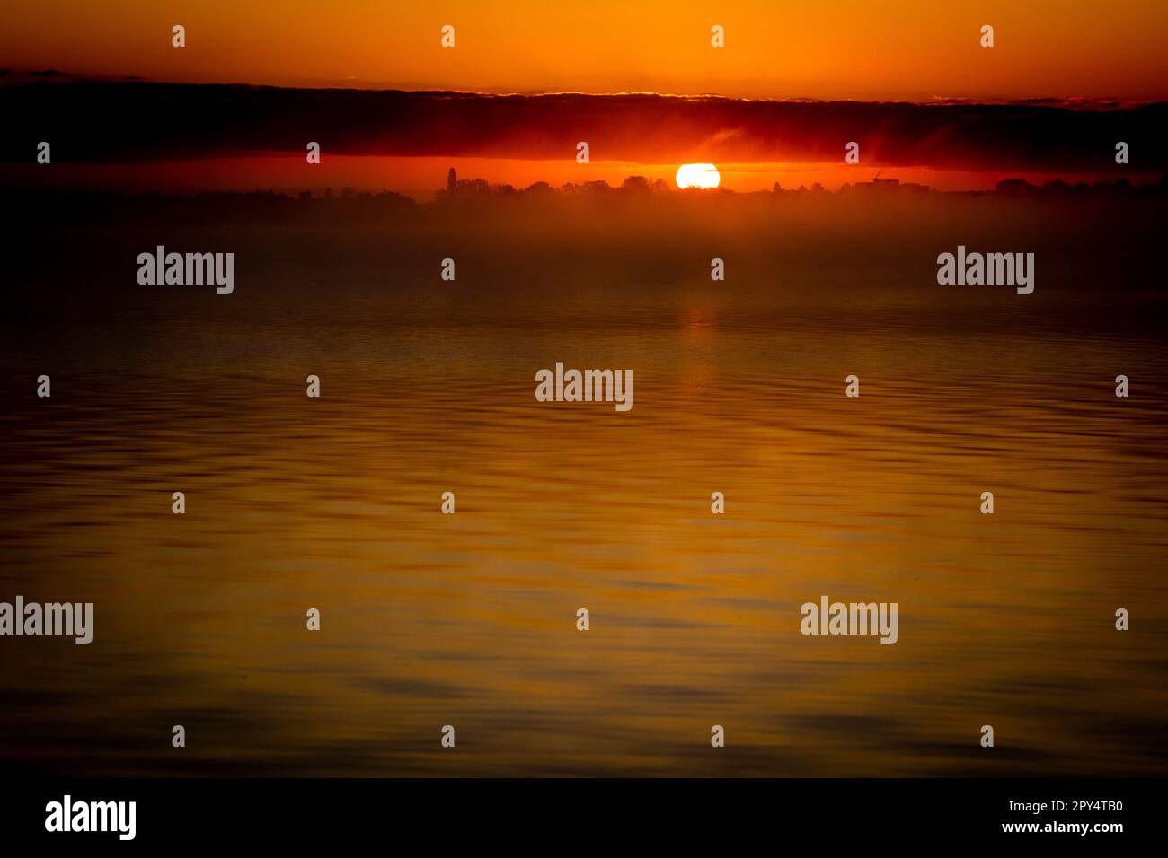 Hagenburg, Germany. 03rd May, 2023. The sun rises over the Steinhuder