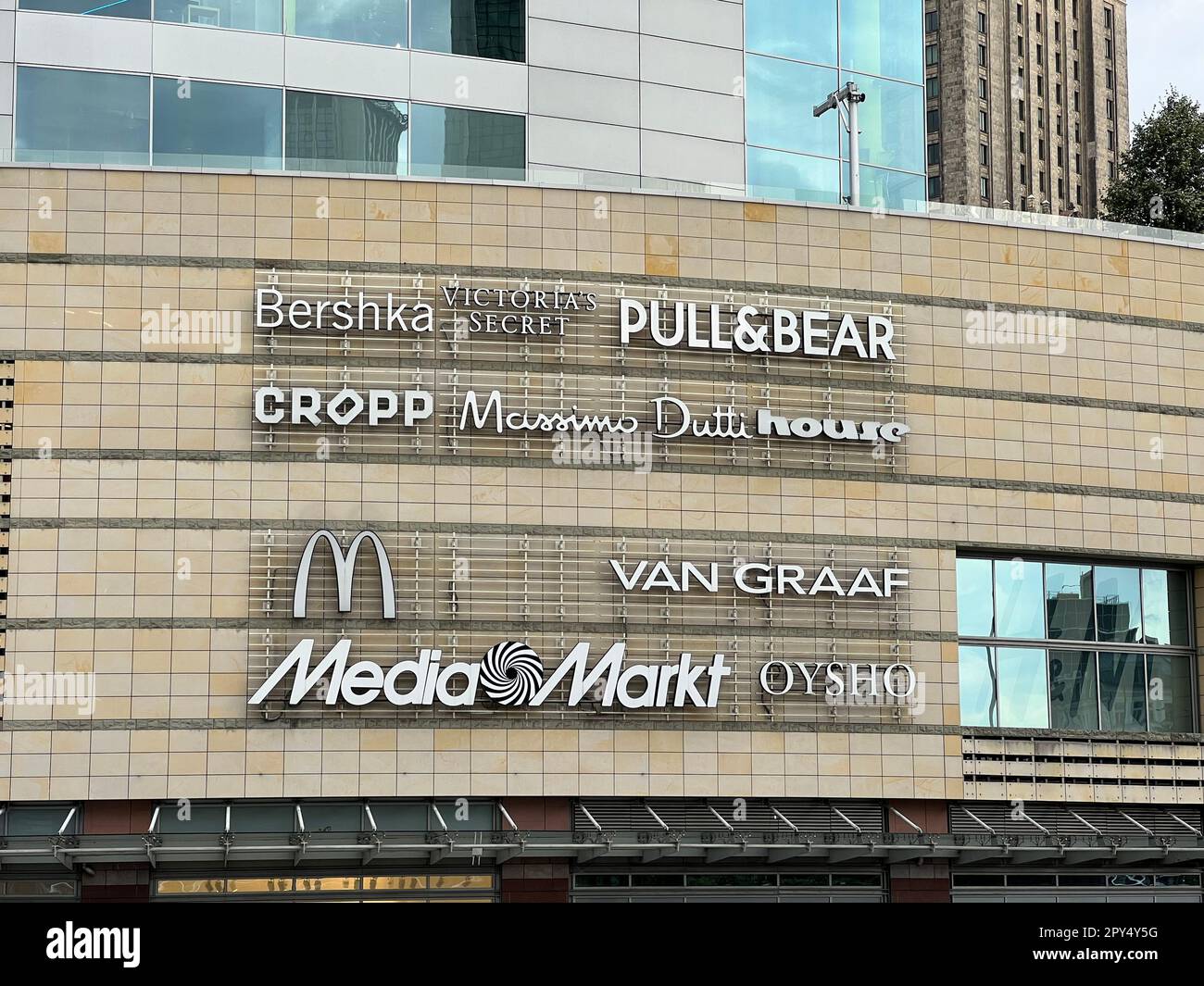 WARSAW, POLAND - JULY 17, 2022: Shopping mall with different store brand logos outdoors Stock Photo
