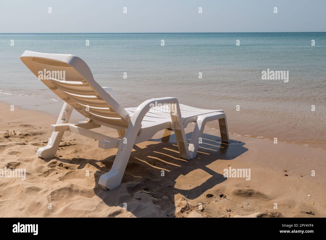 Beach chair at sunny coast at the beach background Stock Photo