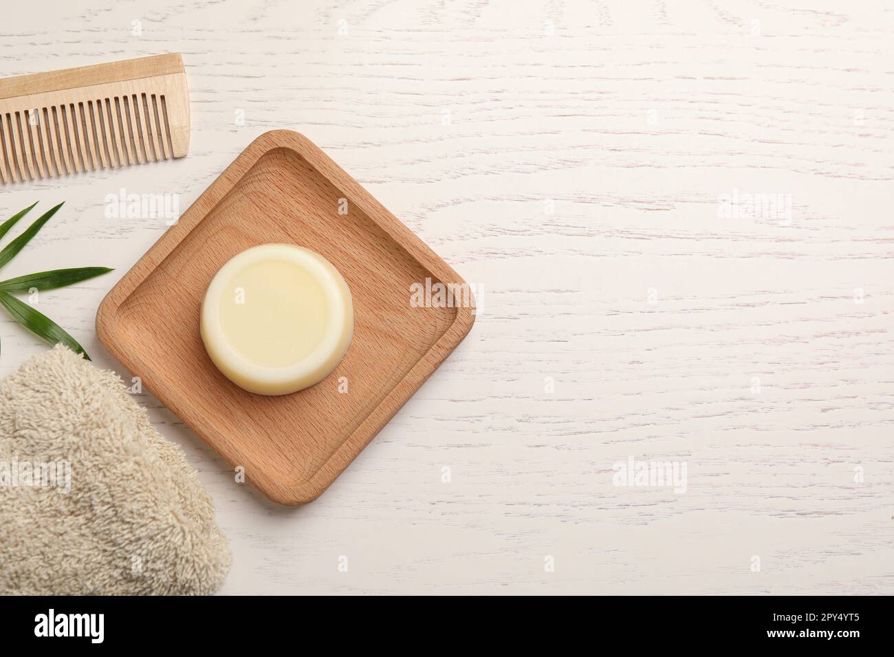 Table For Shapoo Flat lay composition with solid shampoo bar on white wooden table ...