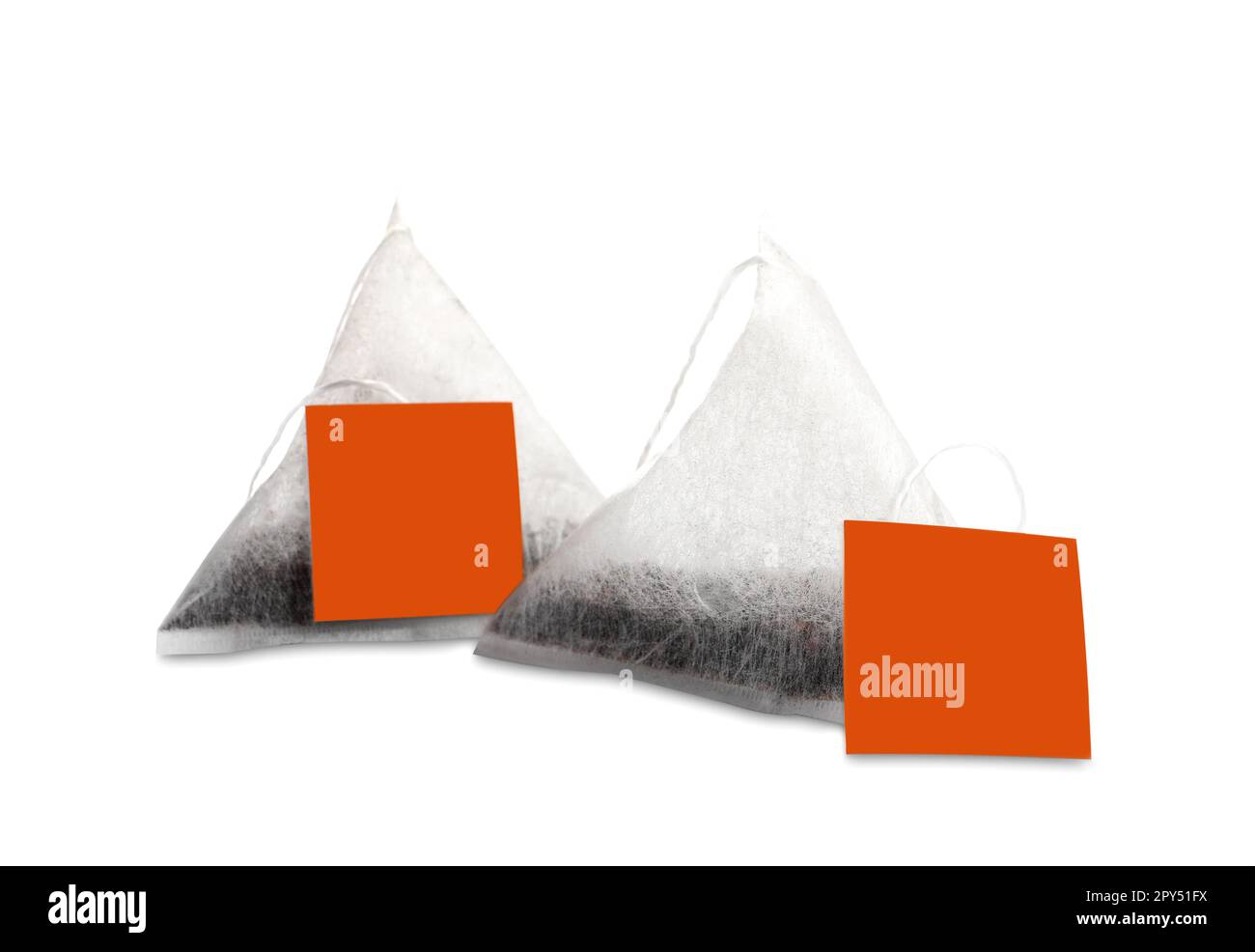 New pyramid tea bags on white background Stock Photo Alamy