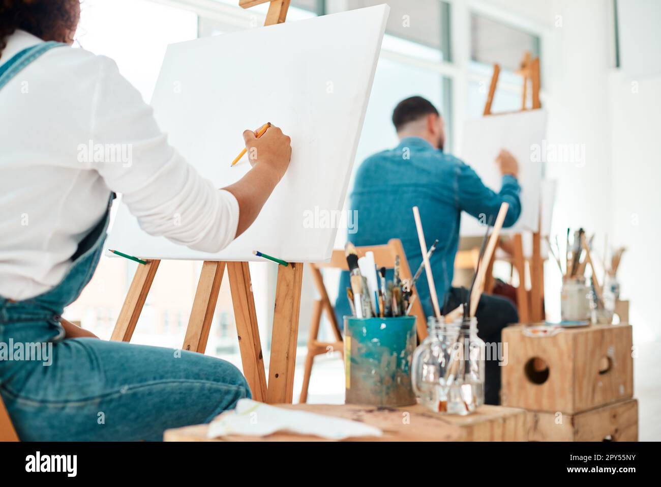 The perfect space to get creative. two unrecognizable artists sitting ...