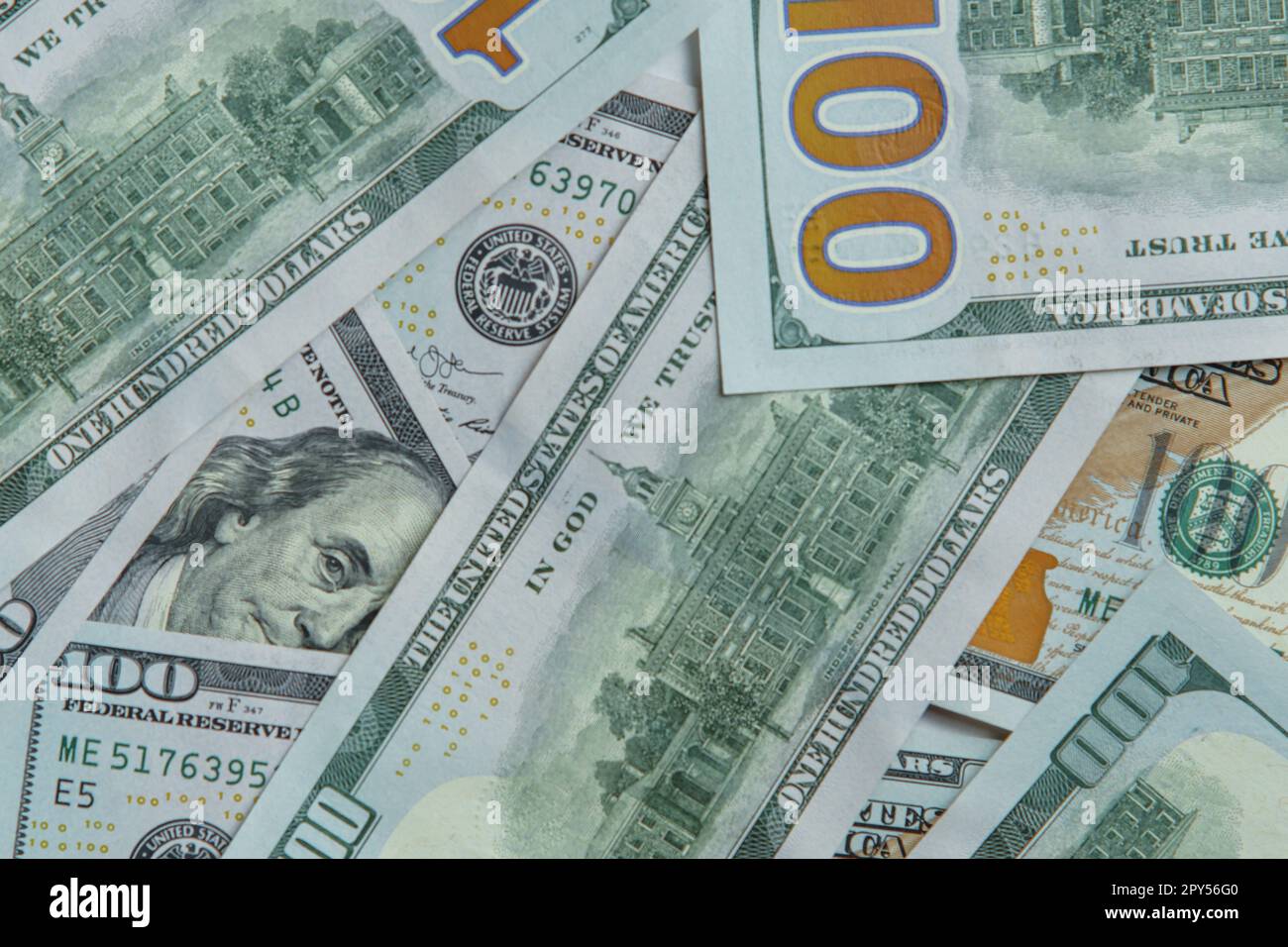 Close-up of pile of one hundred 100 dollars banknotes bills. Paper banknote, money, cash, currency, savings, finance. Stock Photo