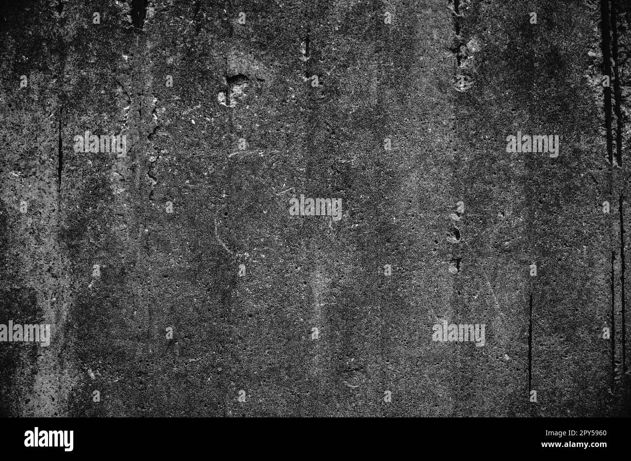 Texture of black white stone wall. Rough surface. Closeup. Dark