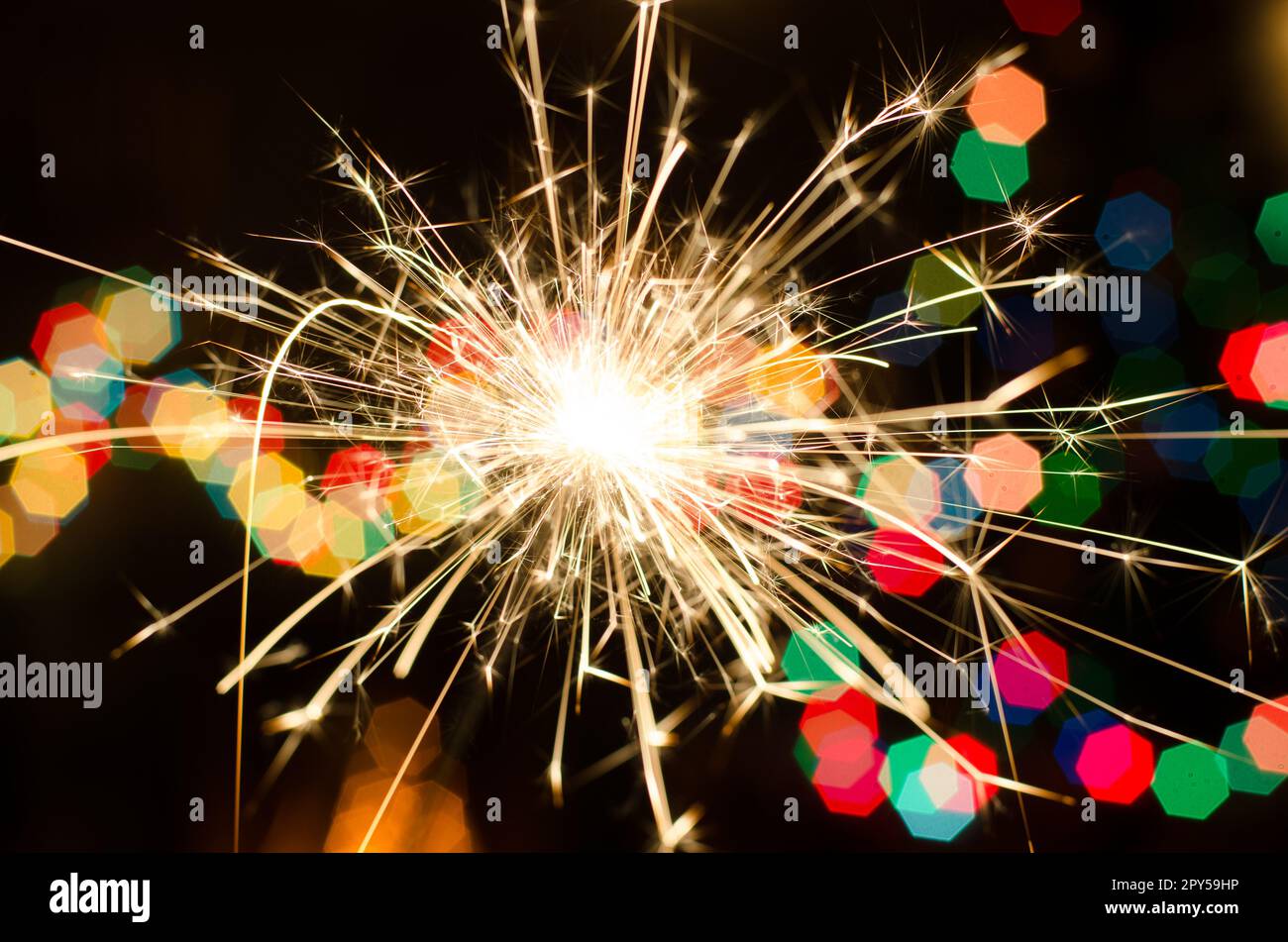 Bengal fire on Christmas tree background Stock Photo