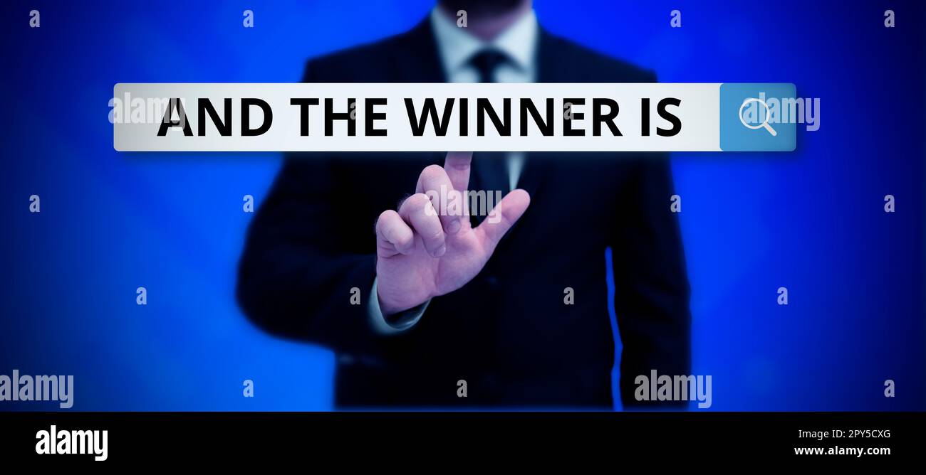 Hand writing sign And The Winner Is. Word for written spoken results of ...