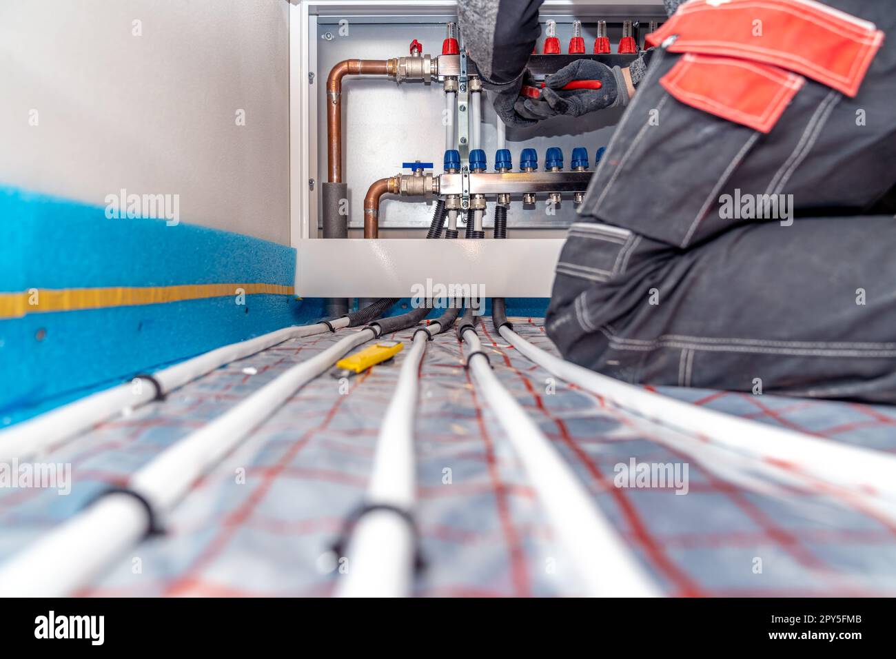 connecting the floor heating to the switchboard Stock Photo