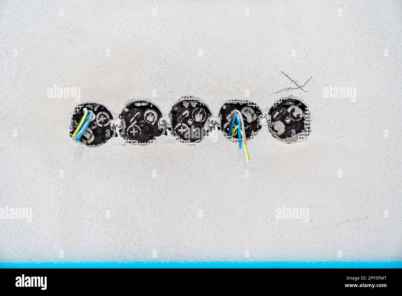 holes and wires in the wall for sockets and switches Stock Photo - Alamy